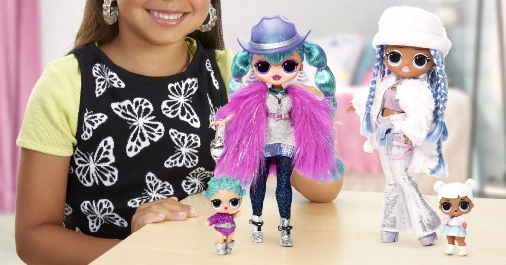 little girl playing with LOL Surprise OMG Winter Disco 2 Pk Exclusive with Cosmic Nova & Snowlicious 