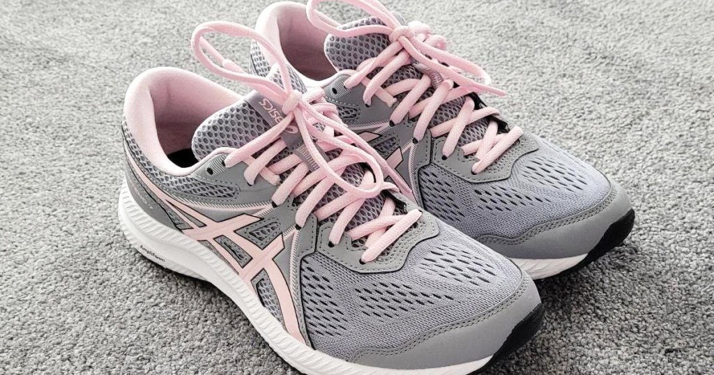 pair of light grey and pink running shoes