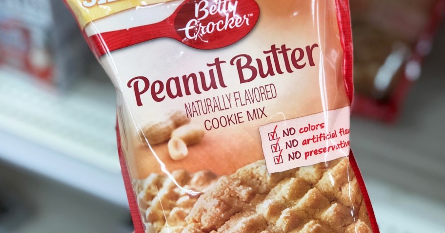 hand holding Betty Crocker Peanut Butter cookie mix