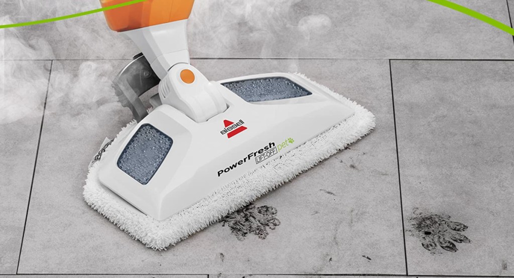 Bissell PowerFresh Lift-Off Pet Steam Mop cleaning the floor of spots