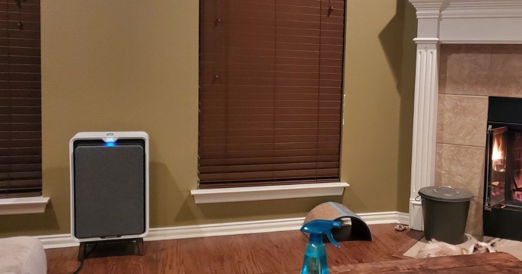 square air purifier next to wall in living room