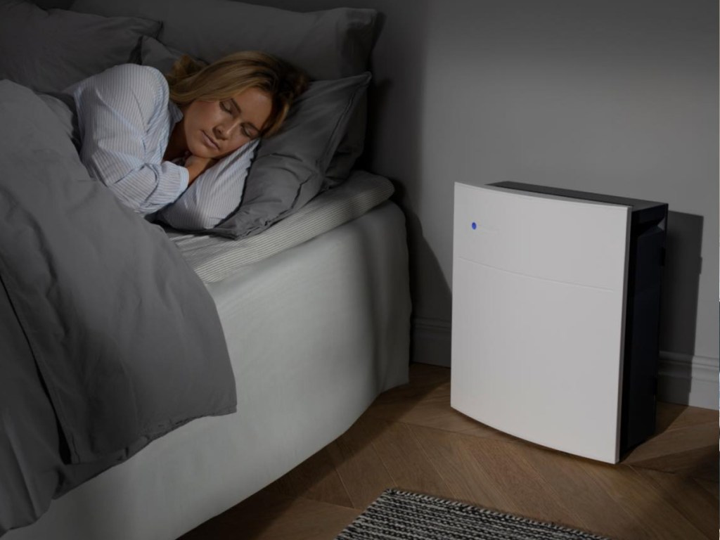 Blueair Air Purifier in bedroom next to woman sleeping