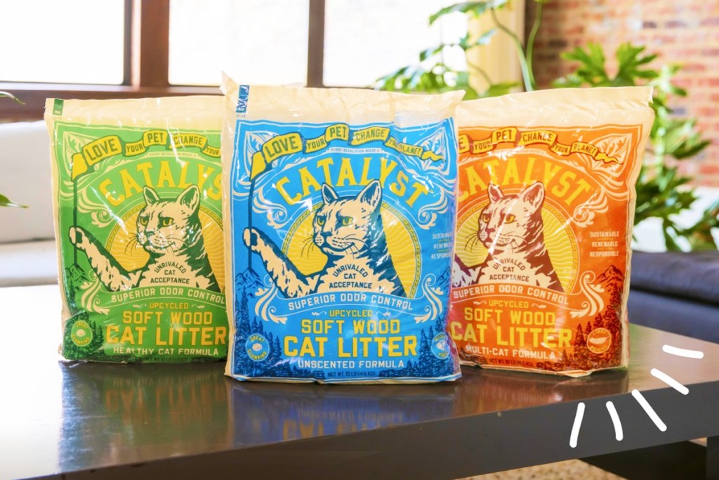 green, blue, and orange bags of catalyst cat litter