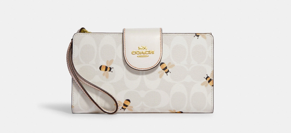 Coach wallet with bees printed on it