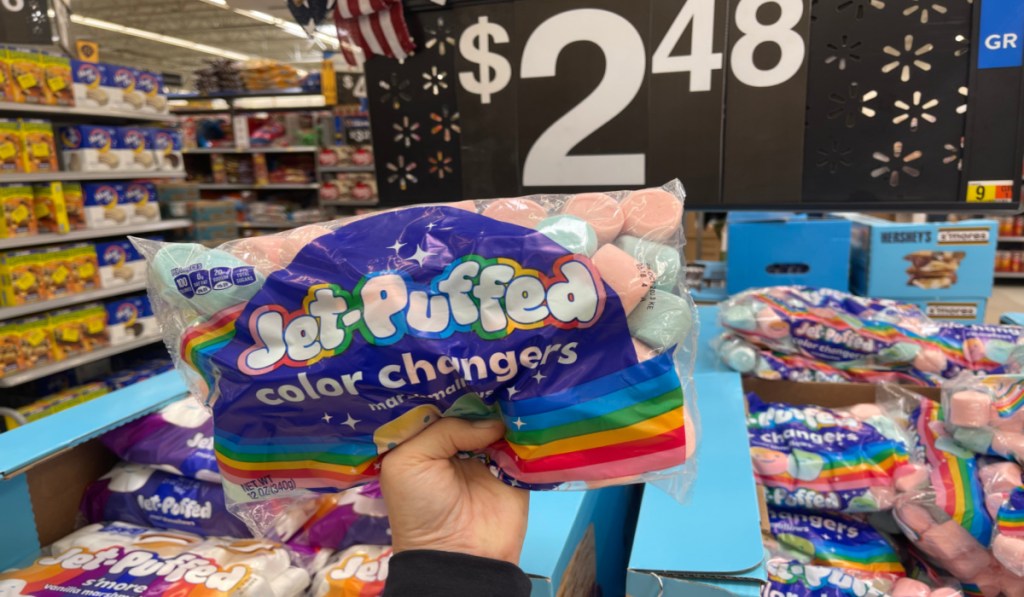 Woman holding a bag of Color Changing Marshmallows at Walmart