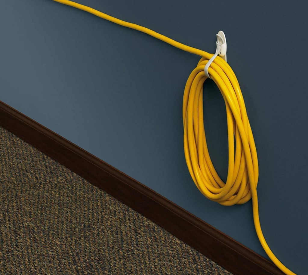 a cord that is neatly organized and bundled using a Command strip cord bundler