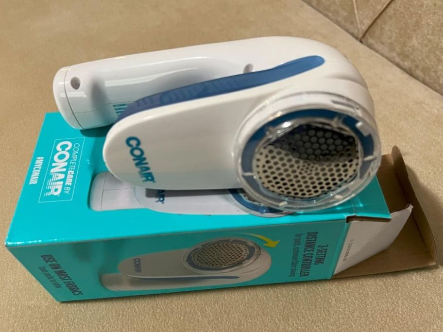 A Conair Fabric Shaver and Lint Remover in White on a box