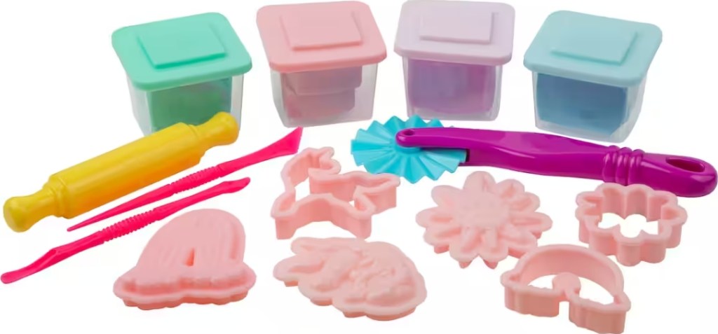 Frou containers of sensory dough and a variety of tools and dough cutters