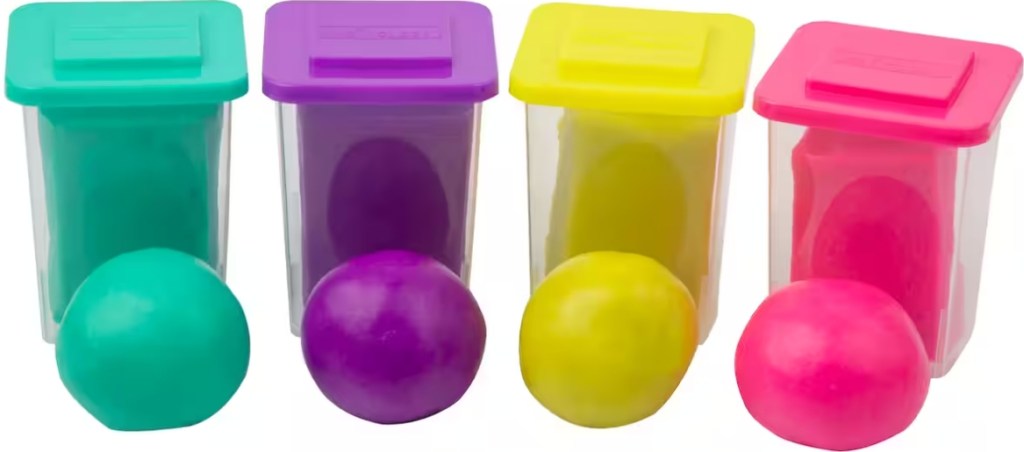 Four containers of Creatology sensory dough in green, purple, yellow, and pink