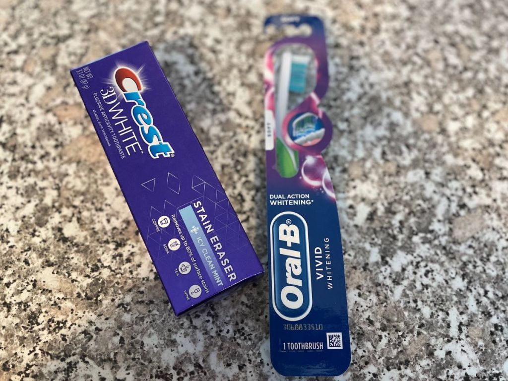 a tube of Crest 3d white toothpaste with an oral B toothbrush