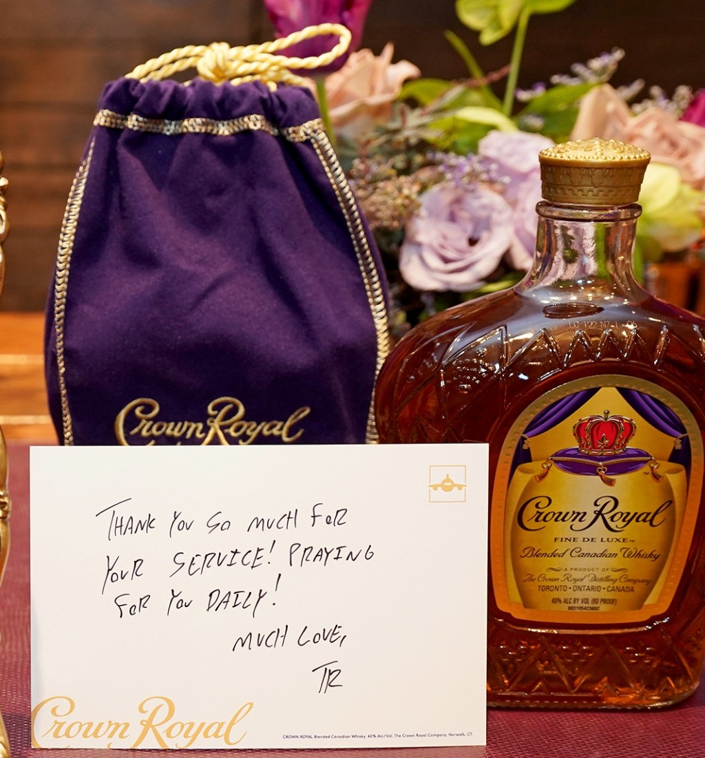 Crown Royal bag and bottle with a thank you note next to them