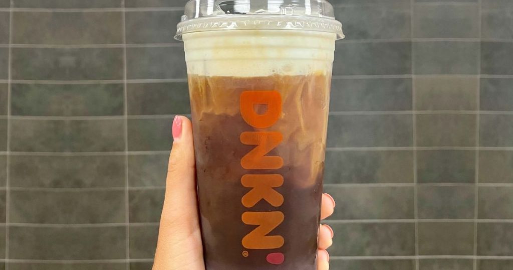 Hand holding a Dunkin Cold Brew Coffee