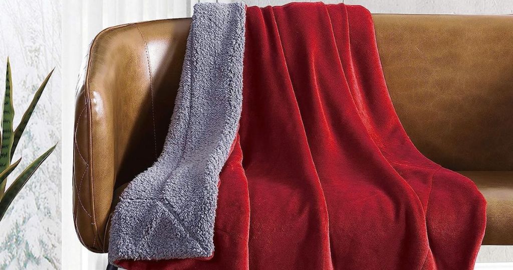 Eddie Bauer Red Reversible Throw draped over couch