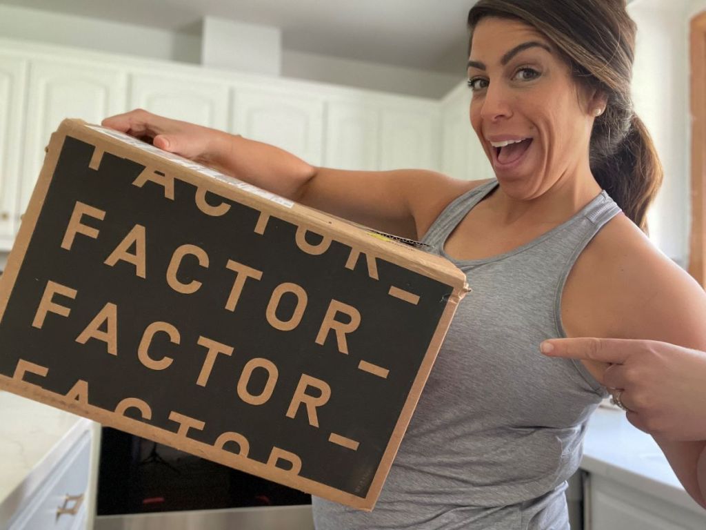 Woman pointing to a Factor meal box
