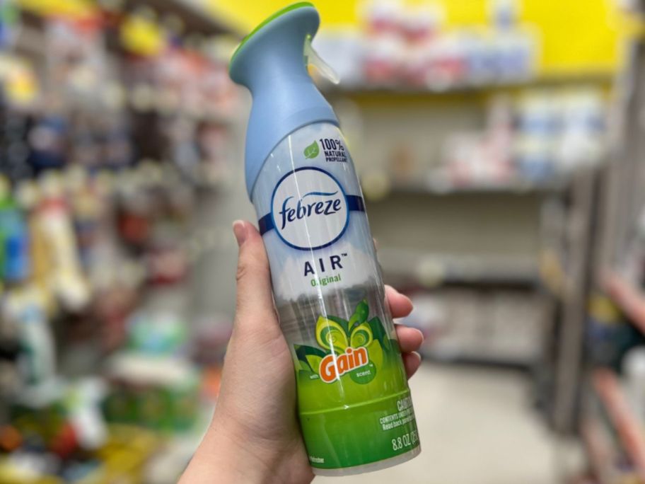 hand holding up a bottle of Febreze air effects