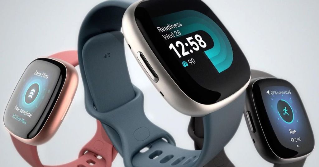 pink, blue and black Fitbit smartwatches
