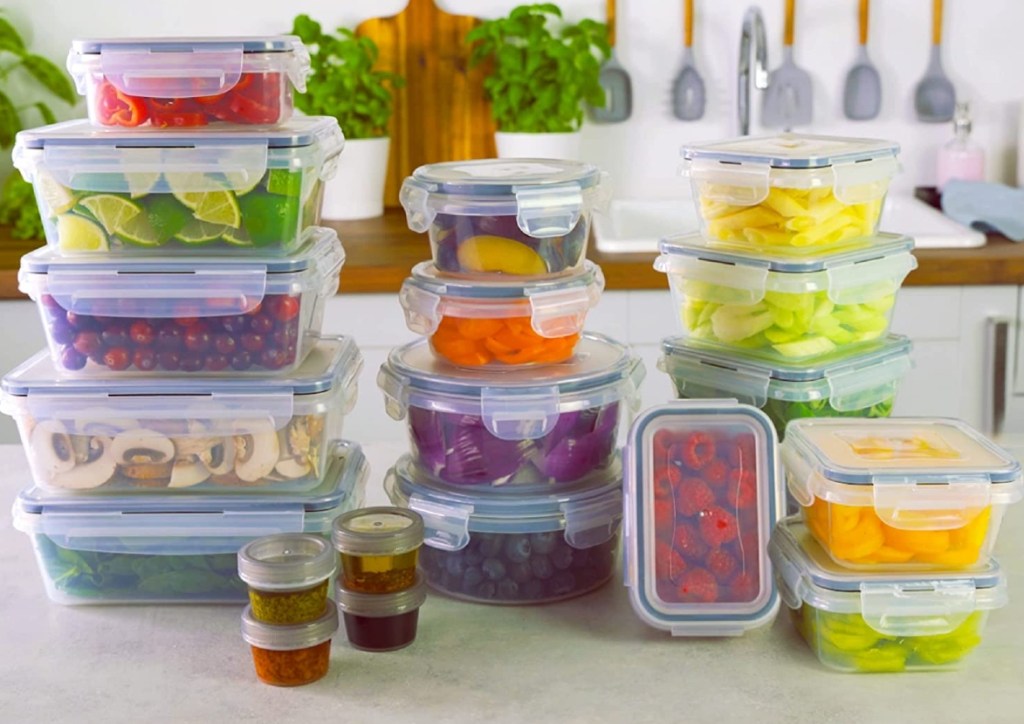 Stacks of meal prep containers with food in them