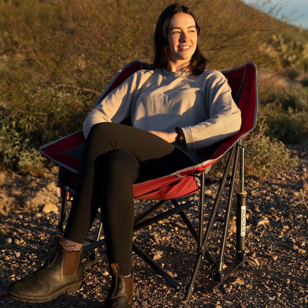 Woman sitting in a GCI Outdoor Pod Rocking Chair