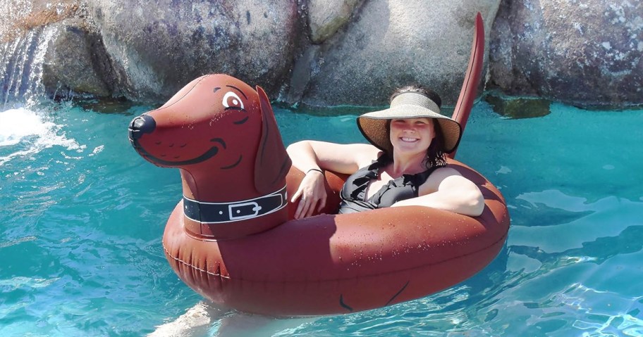 woman in a brown wiener dog pool float