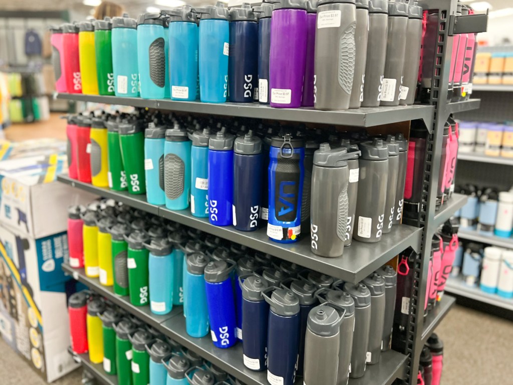 store display of different colored water bottles