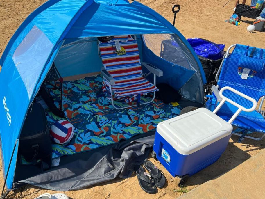 A blue beach tent on the beach 