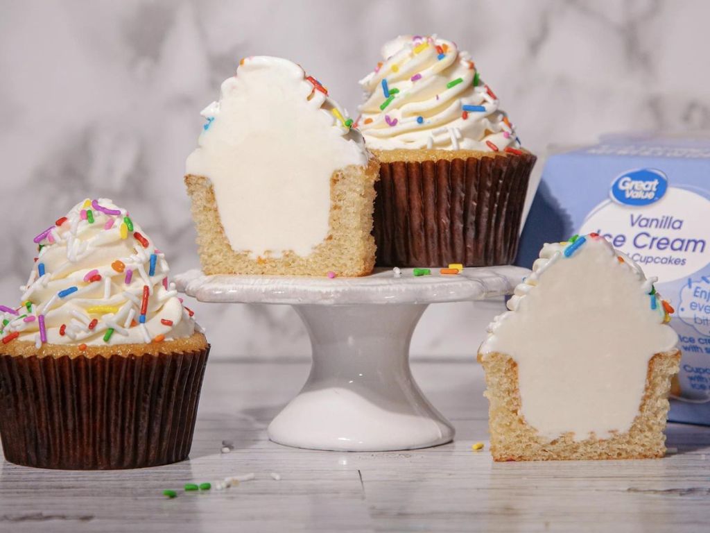 Cupcakes on a tray cut in half with ice cream in them
