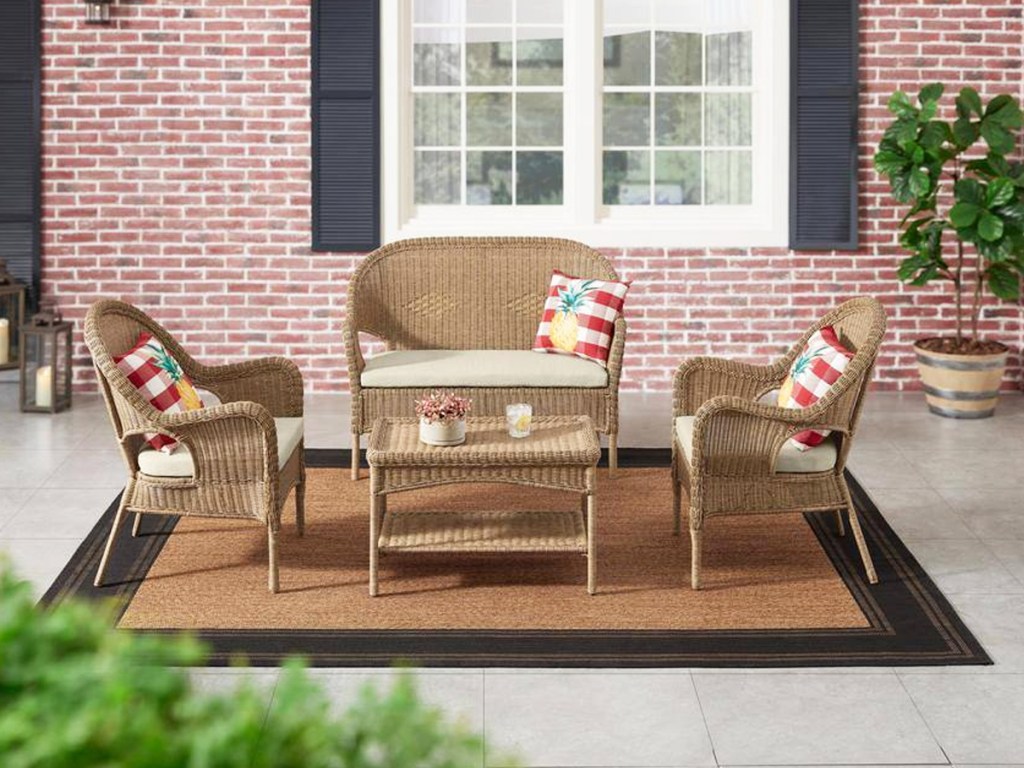 matching wicker patio loveseat, chairs, and coffee table