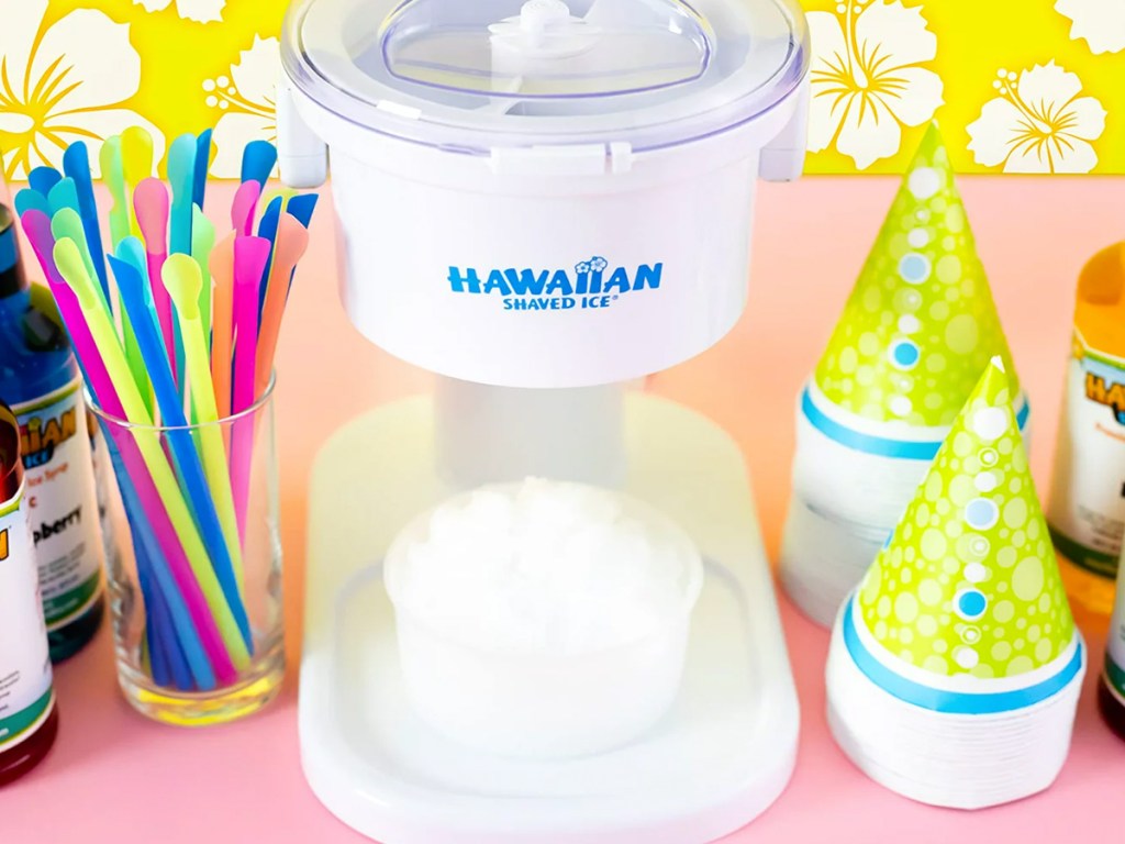 Hawaiian Shaved Ice Machine near straws and snow cone cups