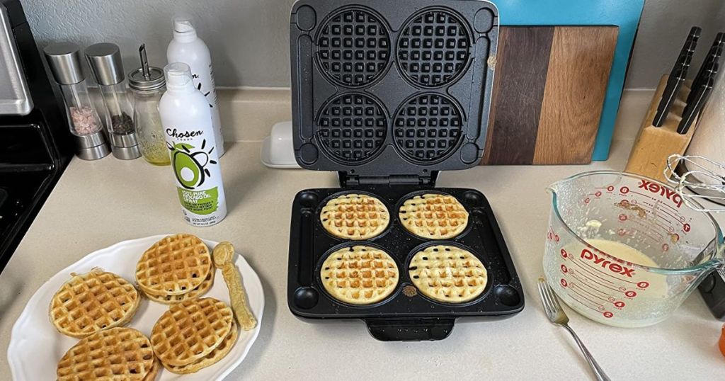 DASH Multi Mini Waffle Maker shown on kitchen counter with waffles and waffle batter