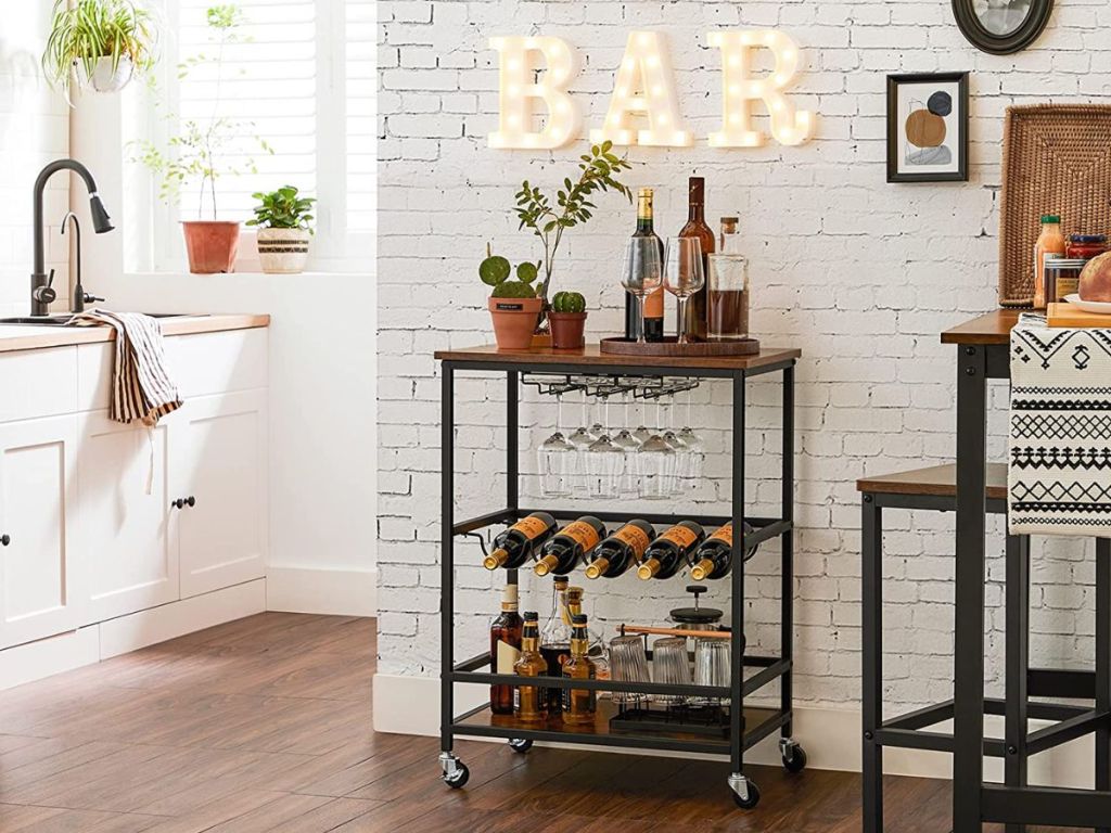 VASAGLE Bar Cart, Serving Cart with Wheels, Glass Stemware Rack and Wine Bottle Holders shown in kitchen / dining room