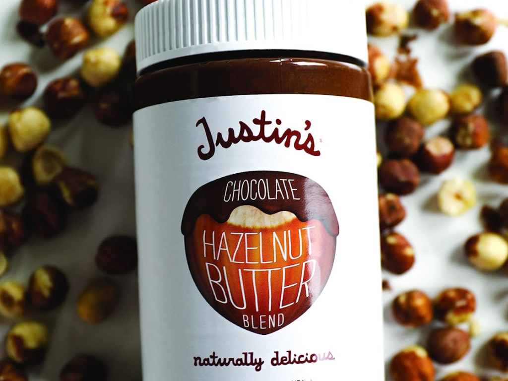Justin's Chocolate Hazelnut and Almond Butter shown with nuts