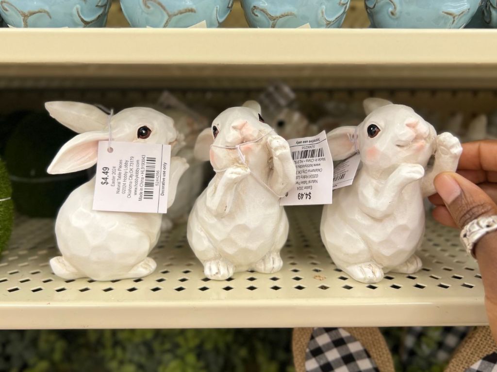 wooden rustic looking white bunny rabbits on shelf