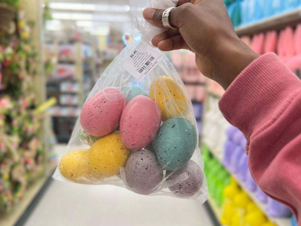 hand holding a bag of speckled easter eggs
