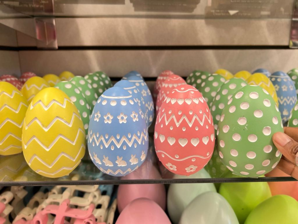 brightly colored decorative Easter Eggs on shelf