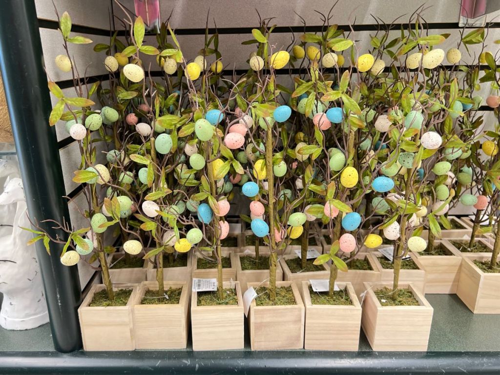 Easter Egg Trees in wooden planter boxes on shelf
