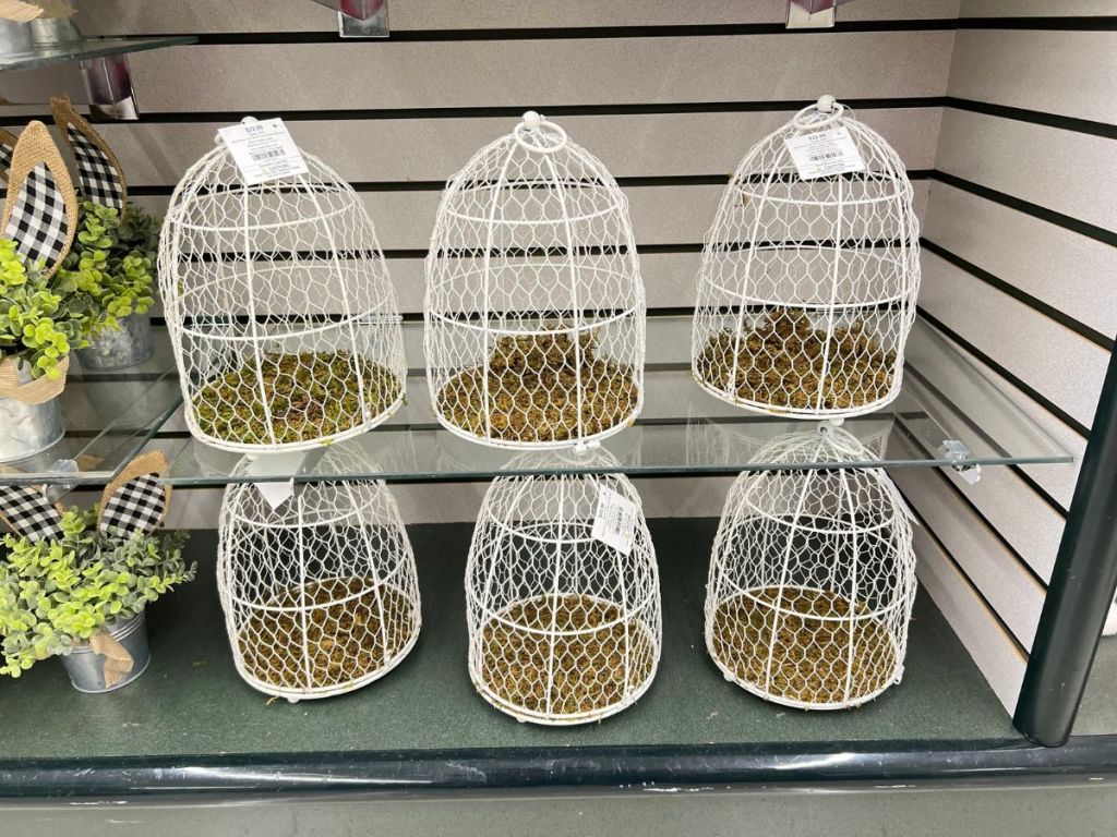 white metal bird cages on display