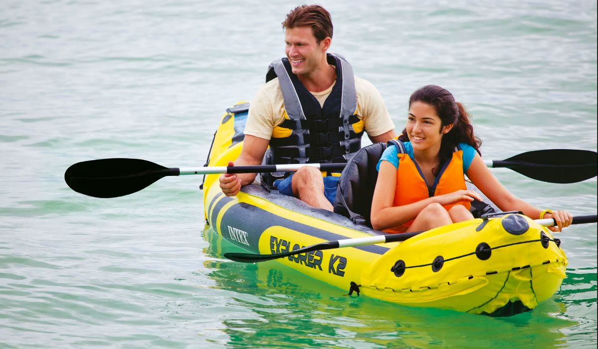 a mand and woman in an Intex Explorer K2 Inflatable Kayak on a lake paddling