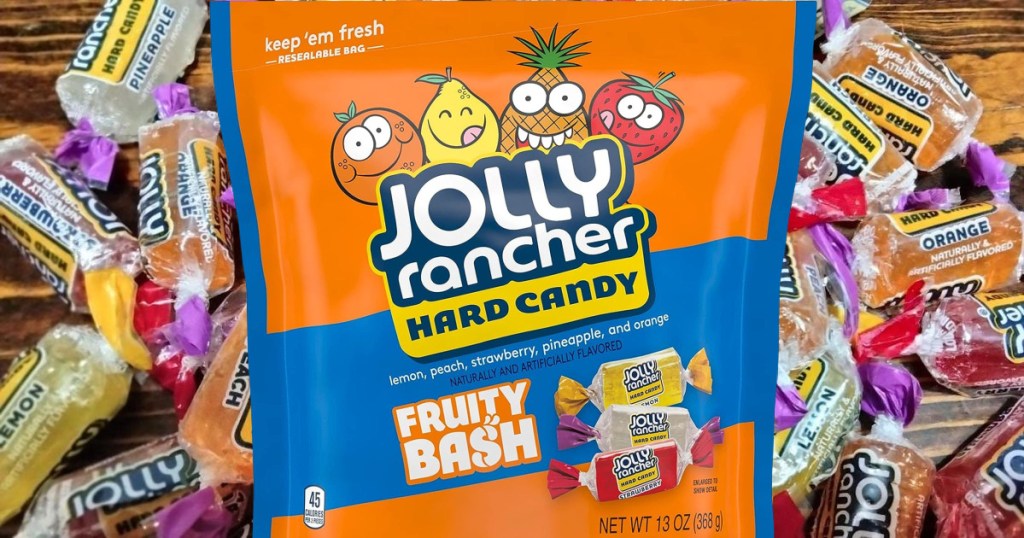 A bag of Jolly Rancher Fruity Bash Candies with the candies in the background