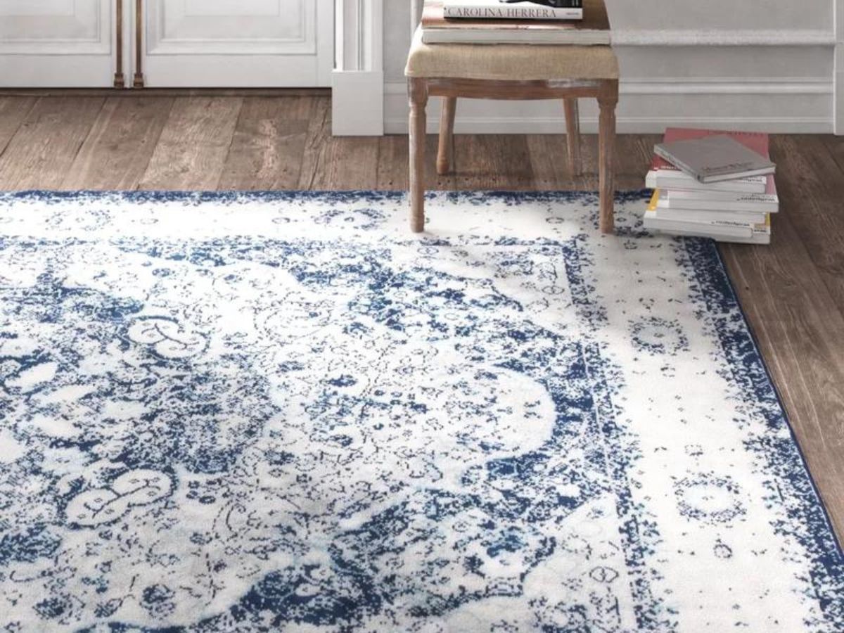 blue and white patterned area rug in living room