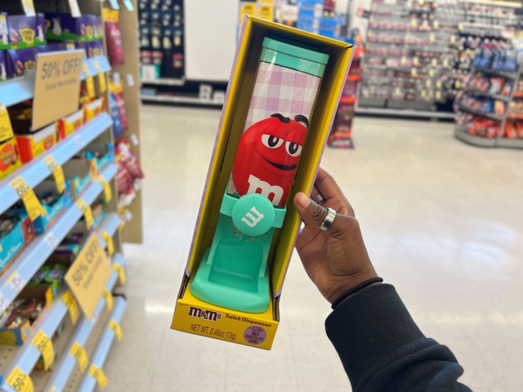 Hand holding an M&M Easter Twist Dispenser 