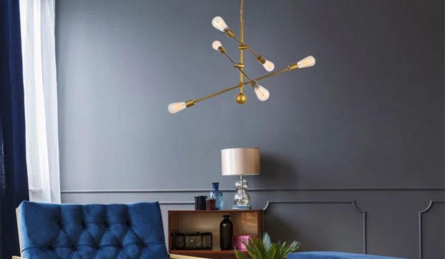 a brass finish sputnik light fixture over a sitting room