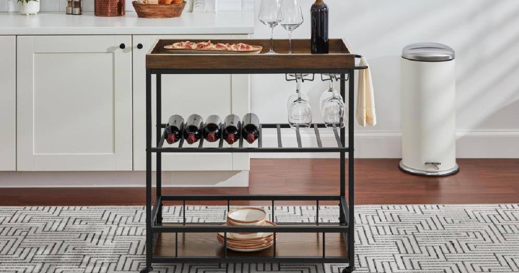 Metal Frame Rolling Kitchen Cart in the kitchen with wine and glasses displayed