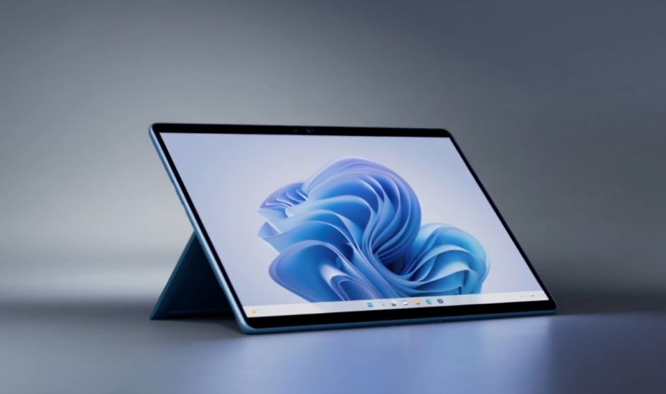 Microsoft Surface Pro 9 tablet with a stand and an art display showing