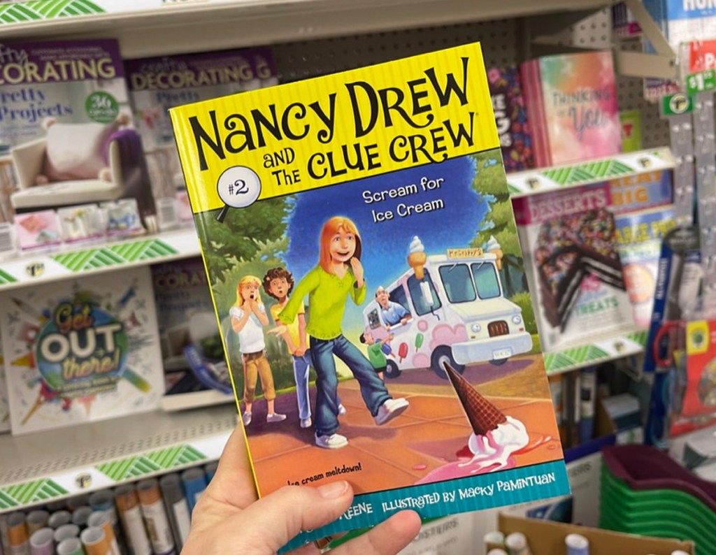 Nancy Drew Book being held in the aisle at Dollar Tree