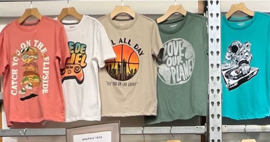 5 Old navy Graphic Tees Hanging up on Display 