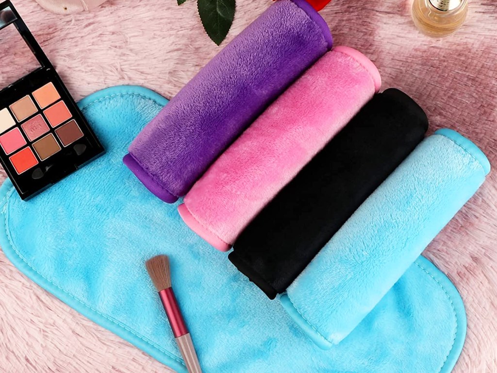 purple, pink, black, and blue makeup remover cloths