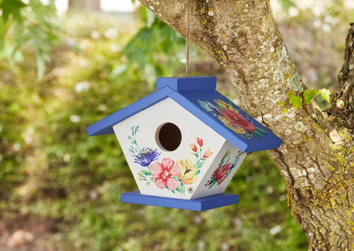 The Delaney Wren Birdhouse from The Pioneer Woman hanging in a tree