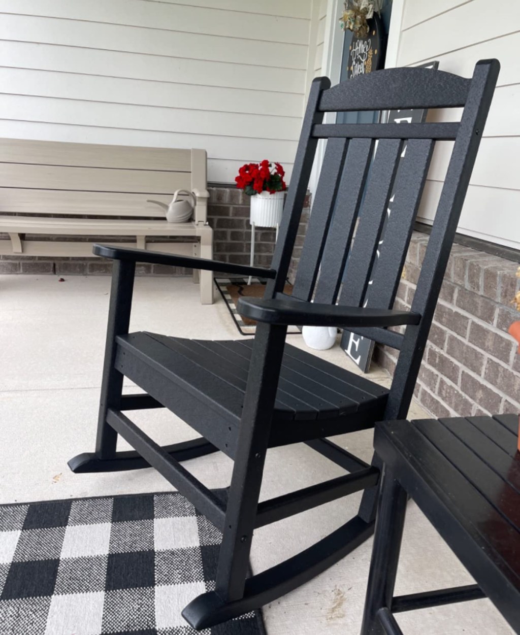 Polywood outdoor rocking chair on a front porch