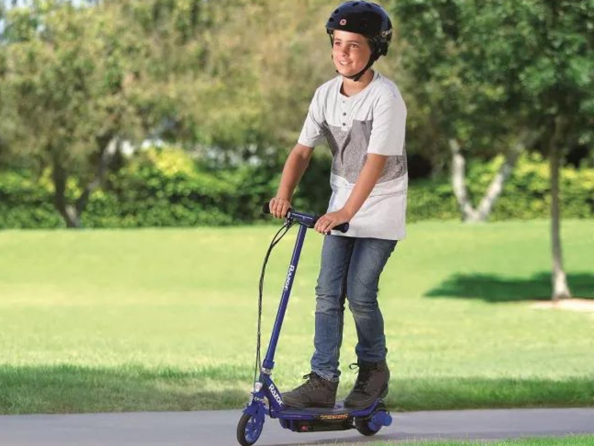 Boy riding an electric scooter