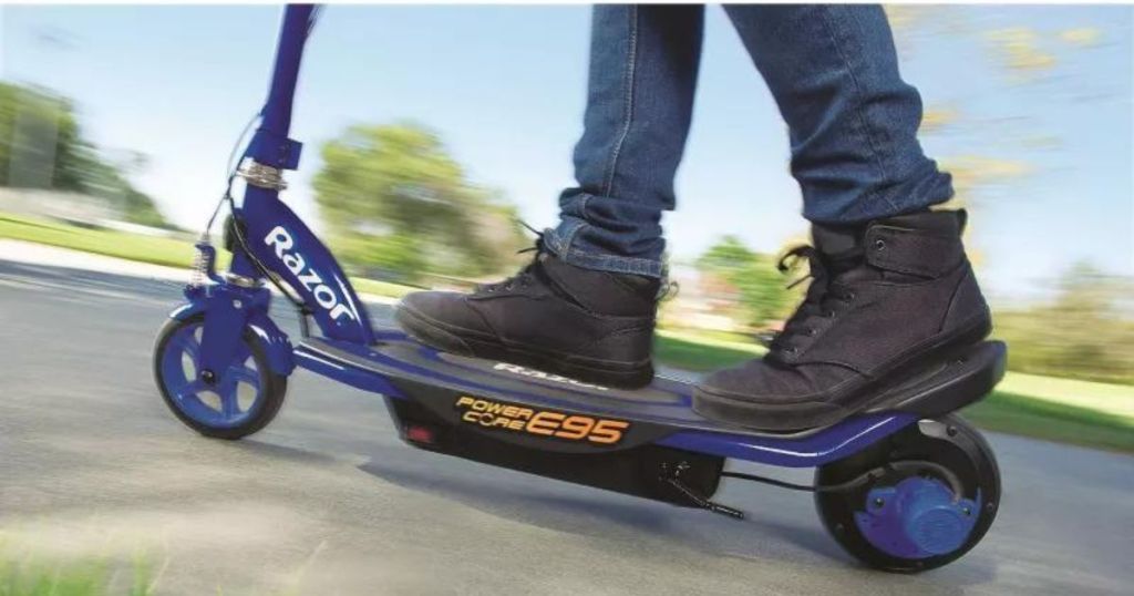Kids feet on a Razor electric scooter